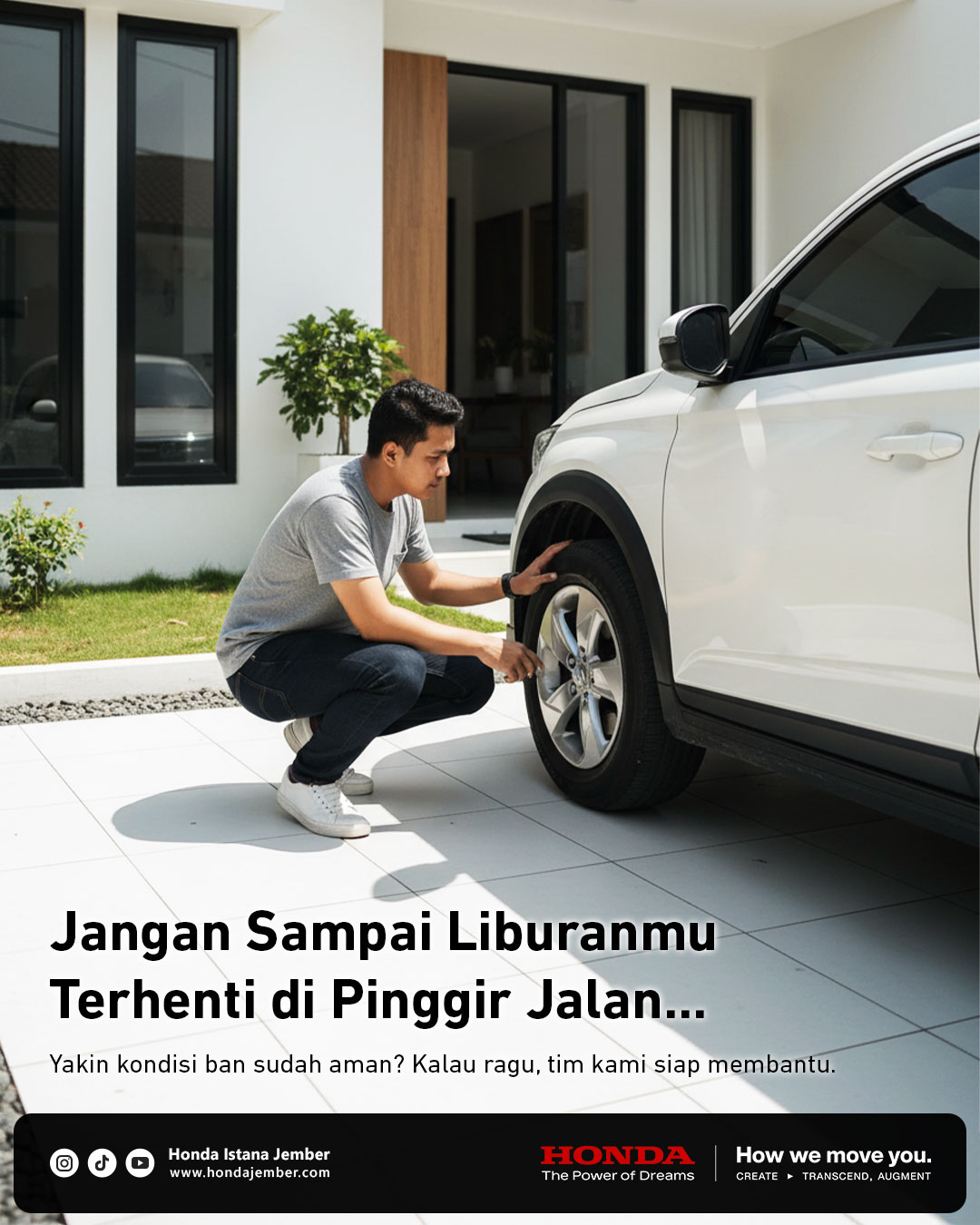 Seorang pria memeriksa ban mobil